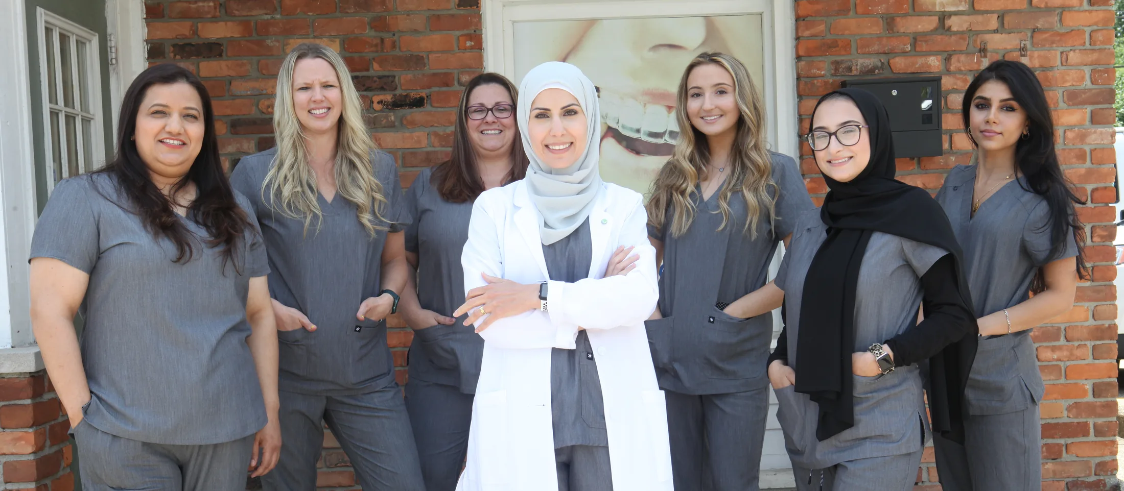 The SmilePro Dental team outside the practice in Dearborn Heights